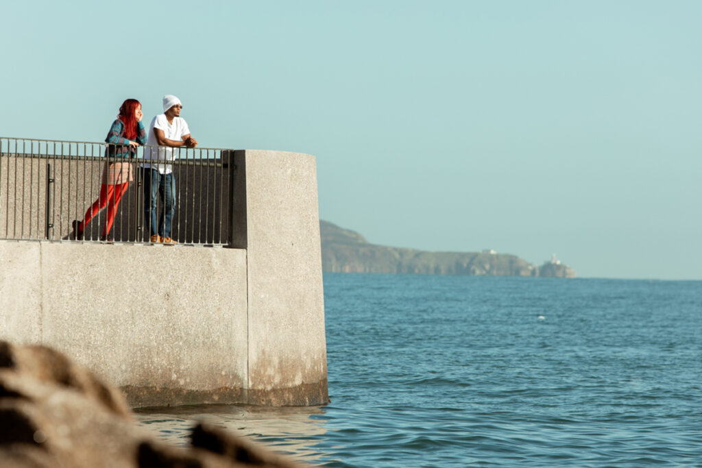 Students looking over the sea